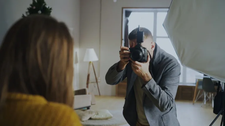 professional photographer taking portrait indoors