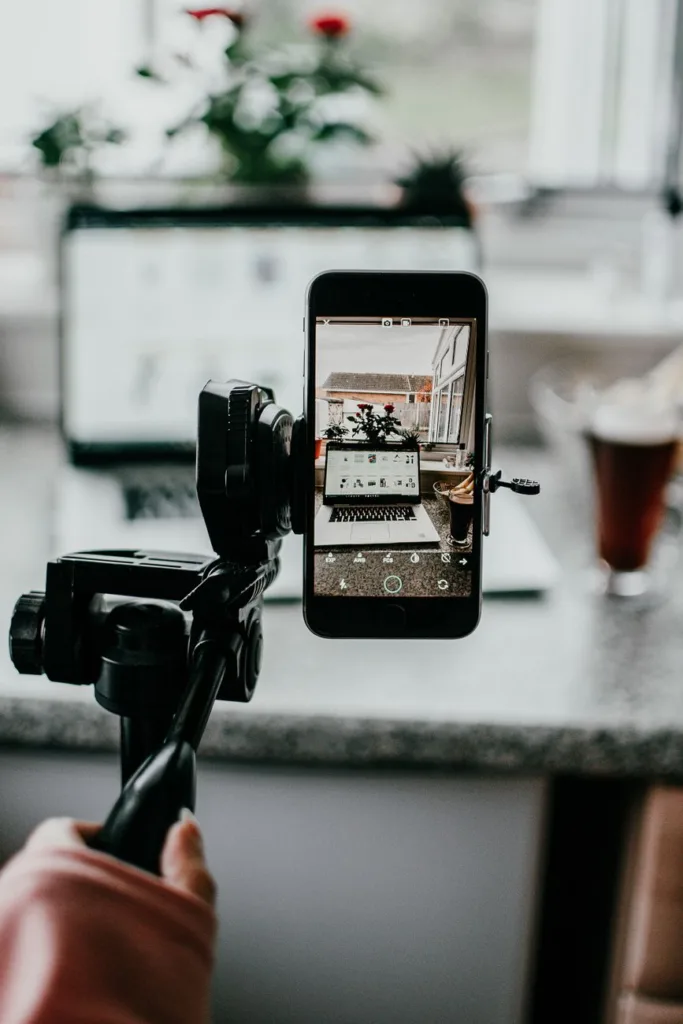 person holding a tripod