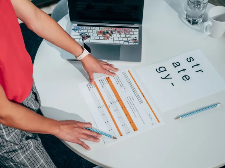 a person looking at the document on the table